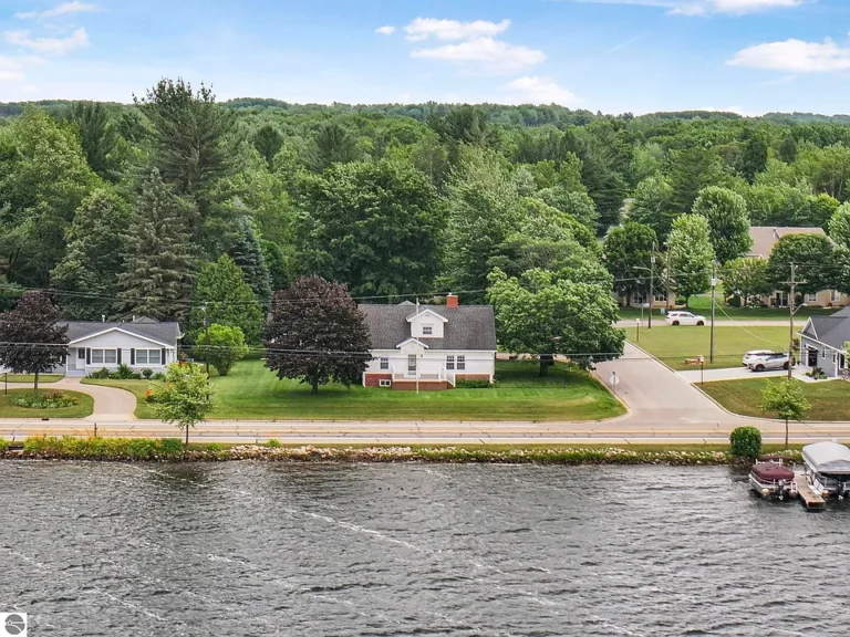 “Lake Cadillac Gem – 100’ Private Frontage & Endless Potential”